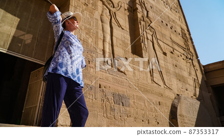 Beautiful woman tourist in Philae Temple Complex. Temple Of Isis. Philae, Agilkia Island, Aswan, Egypt 87353317