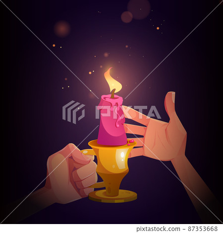 Hands with candle in metal candlestick with handle Hands with candle in metal candlestick with handle 87353668