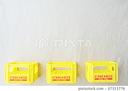 Three boxes of beer cases lined up in the bottom row 87353776