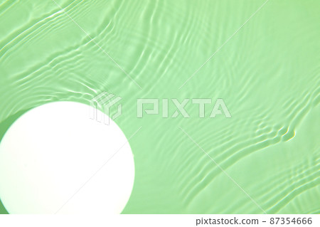 Empty white circle podium on transparent green clear water background 87354666