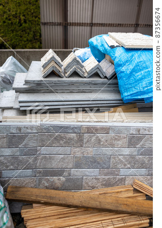 Newly built single-family construction site where exterior wall materials are placed 87356674