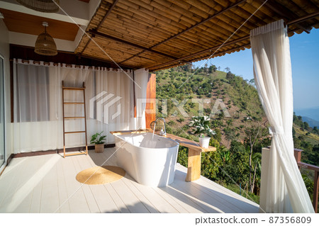 Outdoor bathtub with mountains view ,Doi Chang, Thailand Outdoor bathtub with mountains view ,Doi Chang, Thailand 87356809