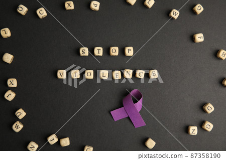 Purple ribbon and phrase STOP VIOLENCE made of wooden cubes on black background, flat lay Purple ribbon and phrase STOP VIOLENCE made of wooden cubes on black background, flat lay 87358190