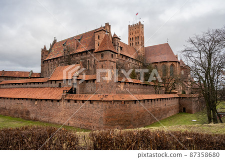 The Castle of the Teutonic Order in Malbork in the Pomerania region, Poland. This is the largest castle in the world measured by land area and a UNESCO World Heritage Site The Castle of the Teutonic Order in Malbork in the Pomerania region, Poland. This is the largest castle in the world measured by land area and a UNESCO World Heritage Site 87358680
