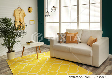 Modern comfortable sofa in stylish home interior 87358958