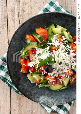 Traditional Bulgarian shopska salad with tomato,cucumber and bulgarian sirene cheese 87359586
