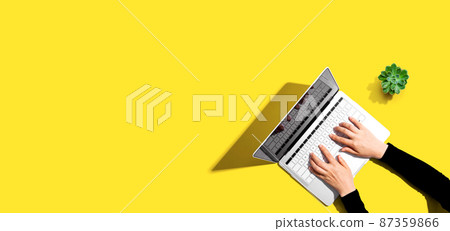 Person using a laptop computer 87359866