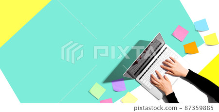 Laptop computer with many sticky notes 87359885