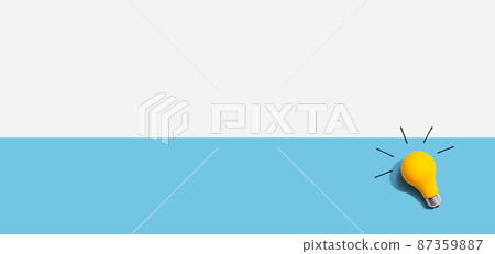 Yellow light bulb - flat lay from above 87359887