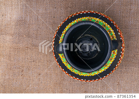 Top view of a black Egyptian handcrafted artistic pottery jar Top view of a black Egyptian handcrafted artistic pottery jar 87361354
