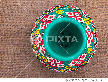 Top view of an Egyptian handcrafted artistic pottery jar Top view of an Egyptian handcrafted artistic pottery jar 87361355