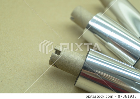 Thermal transfer ribbon - TTR. Wax thermo ribbon on cardboard reel for barcode. Supply material for printing industry. Selective focus Thermal transfer ribbon - TTR. Wax thermo ribbon on cardboard reel for barcode. Supply material for printing industry. Selective focus 87361935