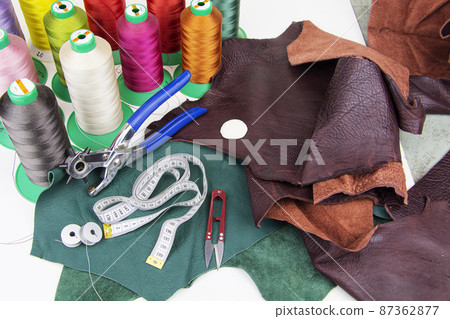 A piece of leather with scissors, needles, chalk, A piece of leather with scissors, needles, chalk, 87362877