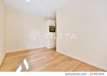 Amazing empty room in daylight with parquet floor Amazing empty room in daylight with parquet floor 87362944