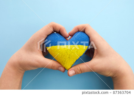 Pray for peace Ukraine. Hands with heart. No war. 87363704
