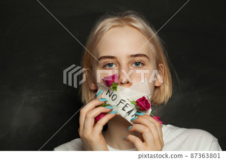 Strength teenager girl with closed mouth riping the gag off her mouth. Awkward age, growing up Strength teenager girl with closed mouth riping the gag off her mouth. Awkward age, growing up 87363801