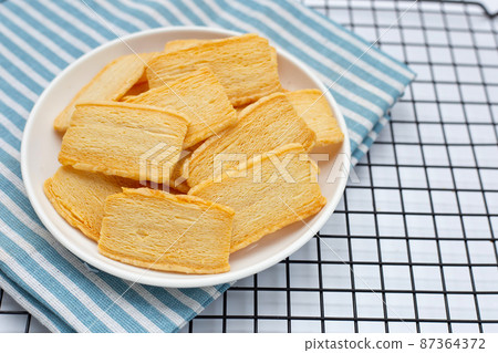 Cheese crispies in white plate Cheese crispies in white plate 87364372