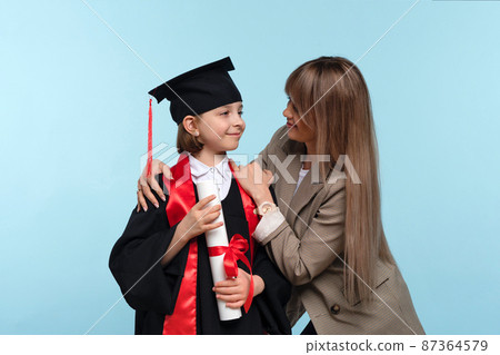 Parent congratulate little genius student Parent congratulate little genius student 87364579