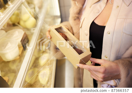 Belper Knolle cheese in the form of small balls. Small Swiss hard cheese balls Belper Knolle. Swiss cheese delicacy concept. Selective focus. 87366357