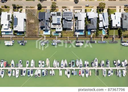 Aerial top down view of contemporary waterfront houses with berth in Melbourne 87367706