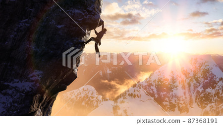 Adult adventurous man Rock Climbing a steep rocky cliff. 87368191