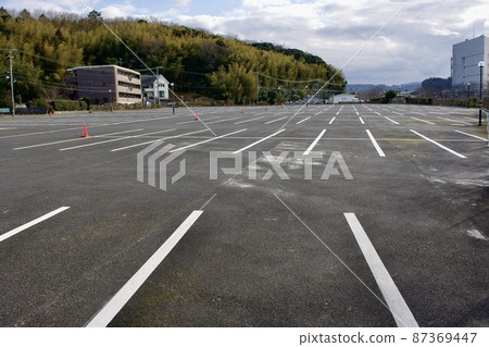 Large parking lot with asphalt pavement Large parking lot with asphalt pavement 87369447