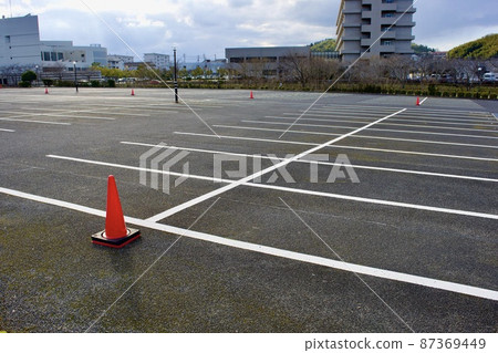 Large parking lot with asphalt pavement Large parking lot with asphalt pavement 87369449