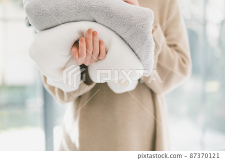 Woman washing towels Woman washing towels 87370121