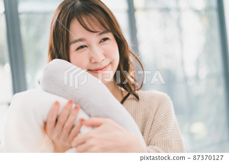 Woman washing towels Woman washing towels 87370127