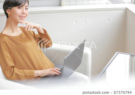 PC_ on your lap Business woman thinking with your hand on your chin 2 87370794