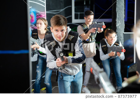 Teenager boy having fun on lasertag arena 87373977