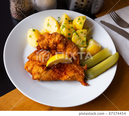 Chicken cutlet with parmesan Chicken cutlet with parmesan 87374454