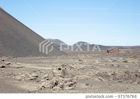 Landscape near El Cuervo volcano at Lanzarote island, Canary Islands Landscape near El Cuervo volcano at Lanzarote island, Canary Islands 87376768