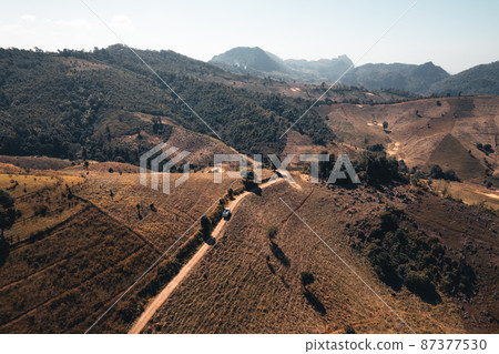 Rocks and farmland are dry during the hot summer days. Rocks and farmland are dry during the hot summer days. 87377530