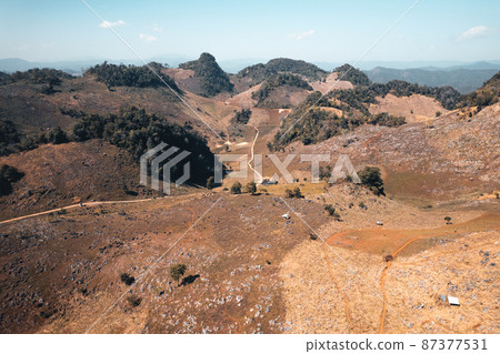 Rocks and farmland are dry during the hot summer days. Rocks and farmland are dry during the hot summer days. 87377531