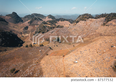 Rocks and farmland are dry during the hot summer days. Rocks and farmland are dry during the hot summer days. 87377532