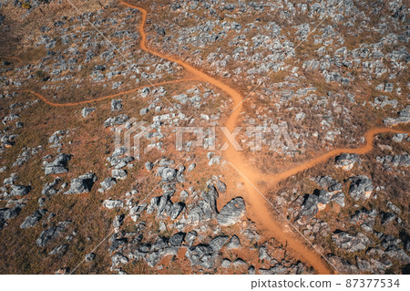 Rocks and farmland are dry during the hot summer days. Rocks and farmland are dry during the hot summer days. 87377534
