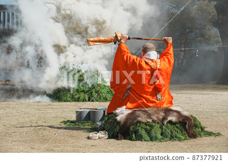 A monk praying for a fire 87377921