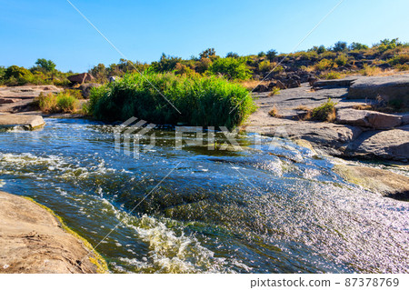 View of Tokovsky waterfalls on the Kamenka river in Dnipropetrovsk region, Ukraine 87378769