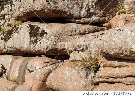 Natural texture of a mountain cliff rock for background Natural texture of a mountain cliff rock for background 87378772