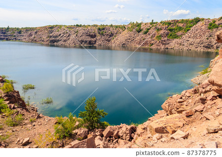 View of the lake at abandoned quarry on summer View of the lake at abandoned quarry on summer 87378775
