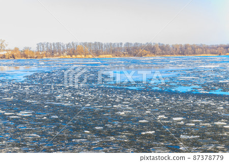 View of a lake with melting ice at spring View of a lake with melting ice at spring 87378779