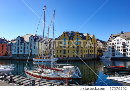 Beautiful streets of Alesund (Norway) and yachts 87379392