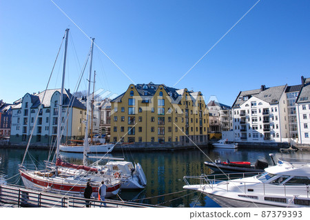 Beautiful streets of Alesund (Norway) and yachts 87379393