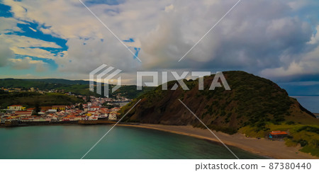 Sunset view to Horta, Porto Pim Bay and beach from mount Guia, Faial island, Azores, Portugal Sunset view to Horta, Porto Pim Bay and beach from mount Guia, Faial island, Azores, Portugal 87380440