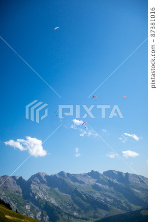 paragliding flight in the mountains. Le Grand-Bornand, France 87381016