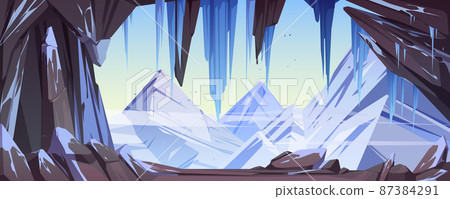 Ice cave with snow and stalactites, mountains 87384291