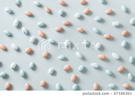 Easter pattern with pastel chocolate eggs on blue background. Easter pattern with pastel chocolate eggs on blue background. 87386365