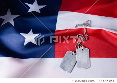 USA Memorial Day concept. American flag and military dog tags. USA Memorial Day concept. American flag and military dog tags. 87386563