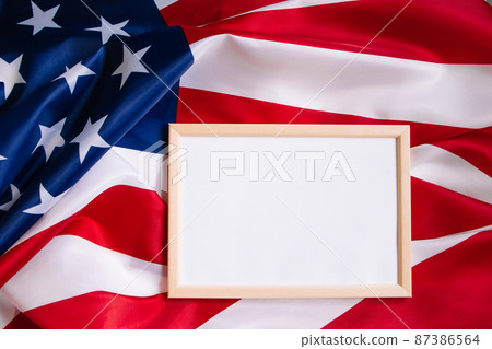 American flag and empty frame for text. Independence, Memorial Day. Culture of the USA. American flag and empty frame for text. Independence, Memorial Day. Culture of the USA. 87386564